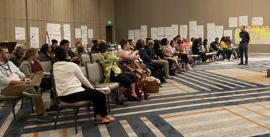 Photo of participants in group discussion during TFSC in-person working session